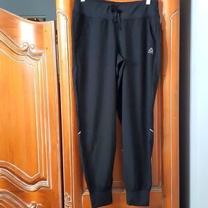 REEBOK jogging pants. Big pockets in front. Cuff bottom.  Size small. EXCELLENT